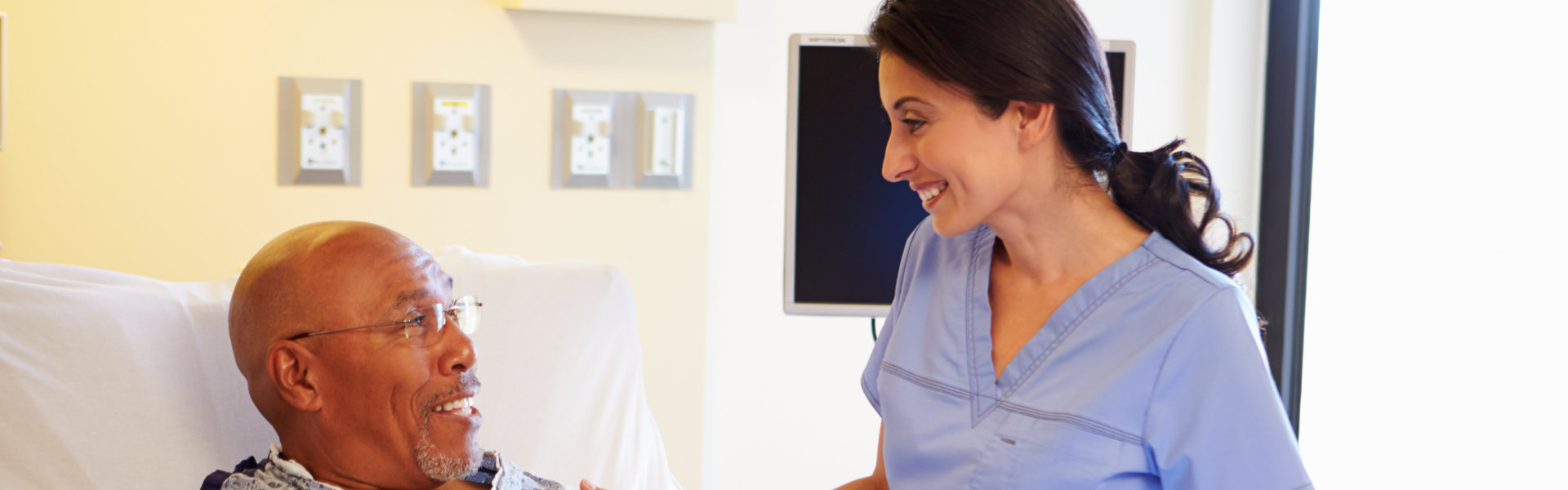 caregiver talking with patient man